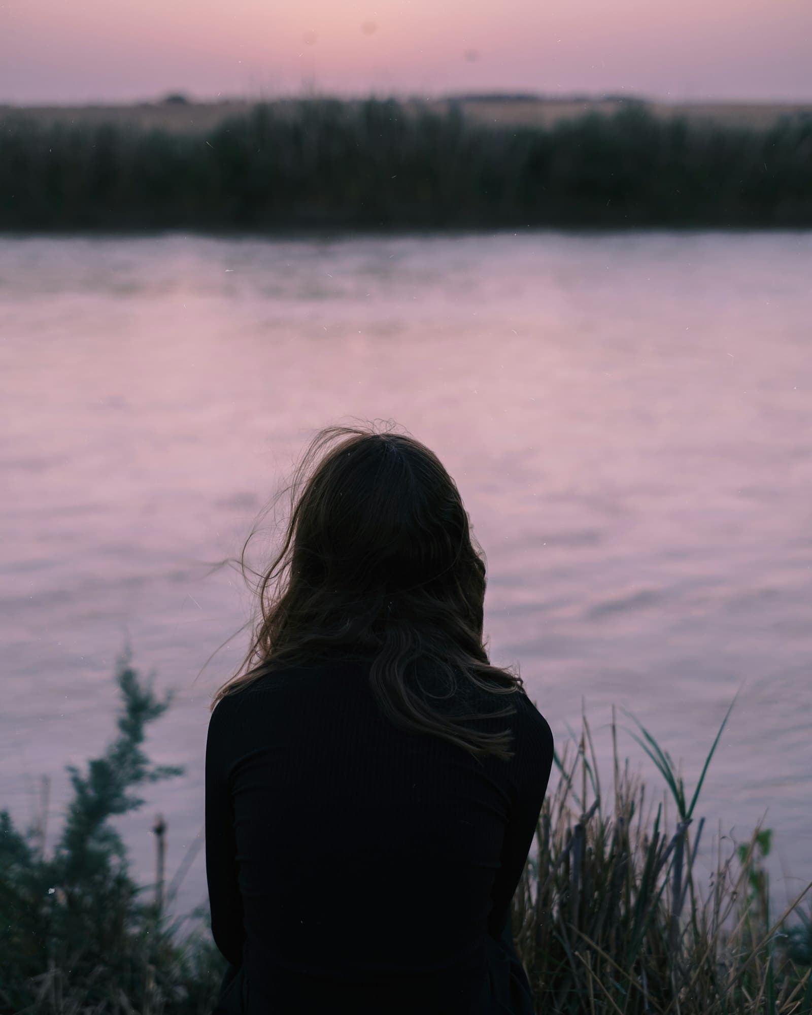 Last pink light over a still lake