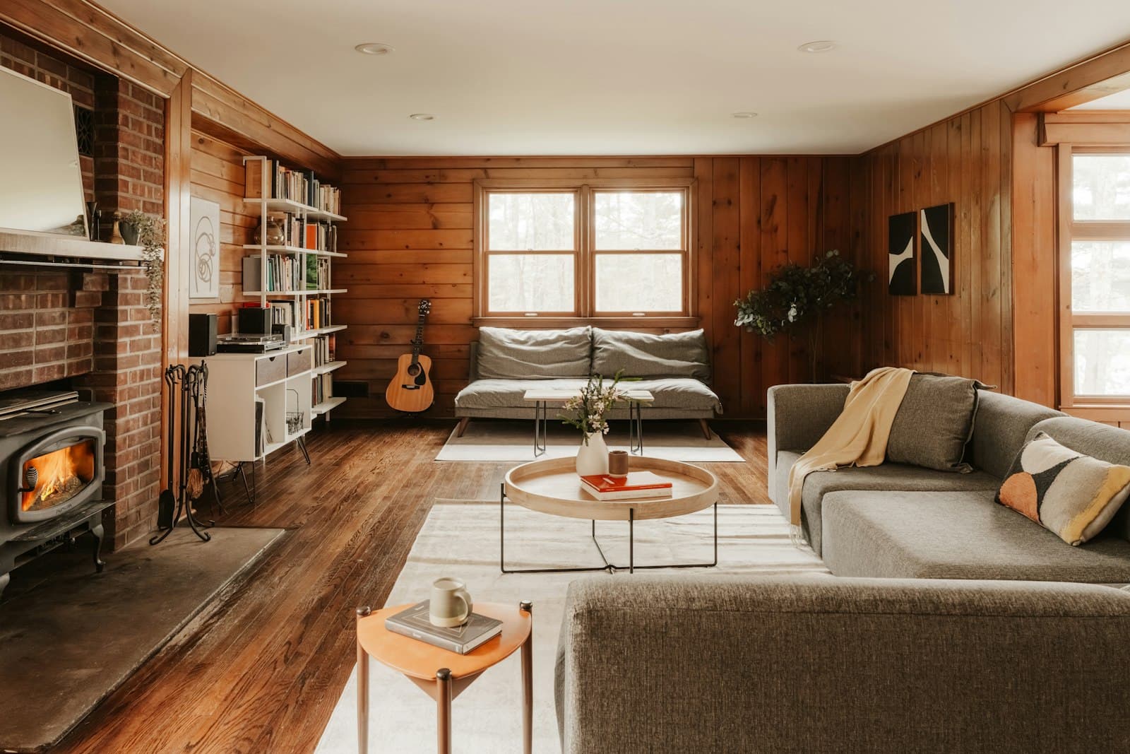 The cabin living room, lamps on